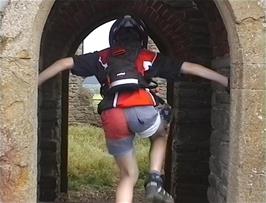 Lee explores the ruined church on top of Burrow Mump, although his landing isn't quite as planned